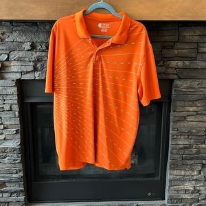 Men’s golf shirt in rust colour with detailing across the front